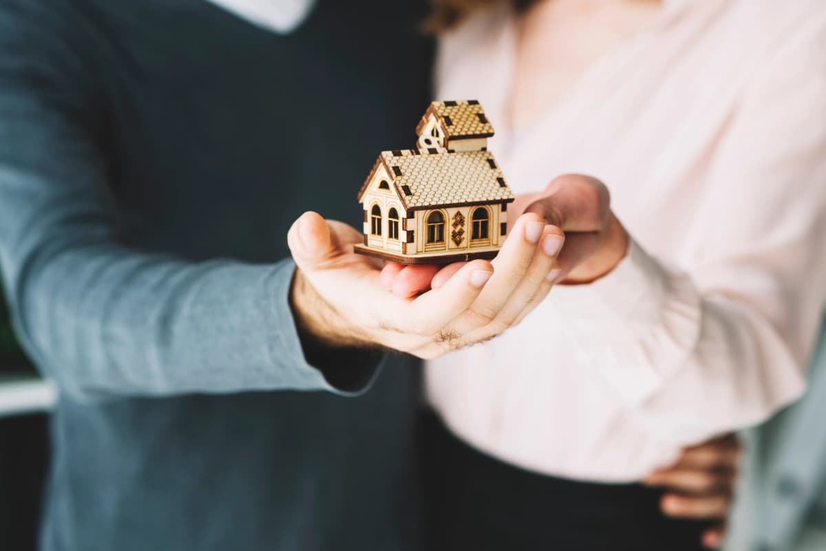 Couple with toy house